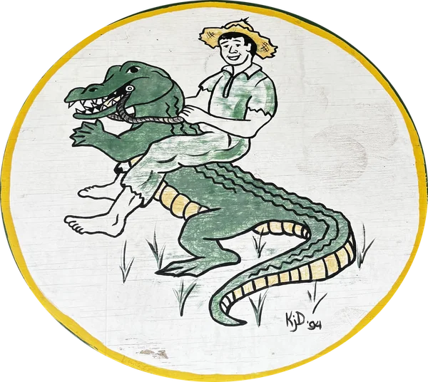The 1994 hand-painted Sixth Ward Cajuns emblem: a boy in a straw hat riding an alligator