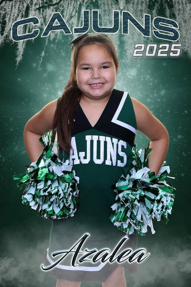 A printed cheer banner of a girl in a green and black Cajuns cheerleading uniform with pompoms